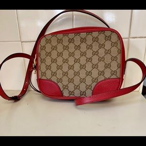 Red leather trimmed authentic Gucci cross body bag